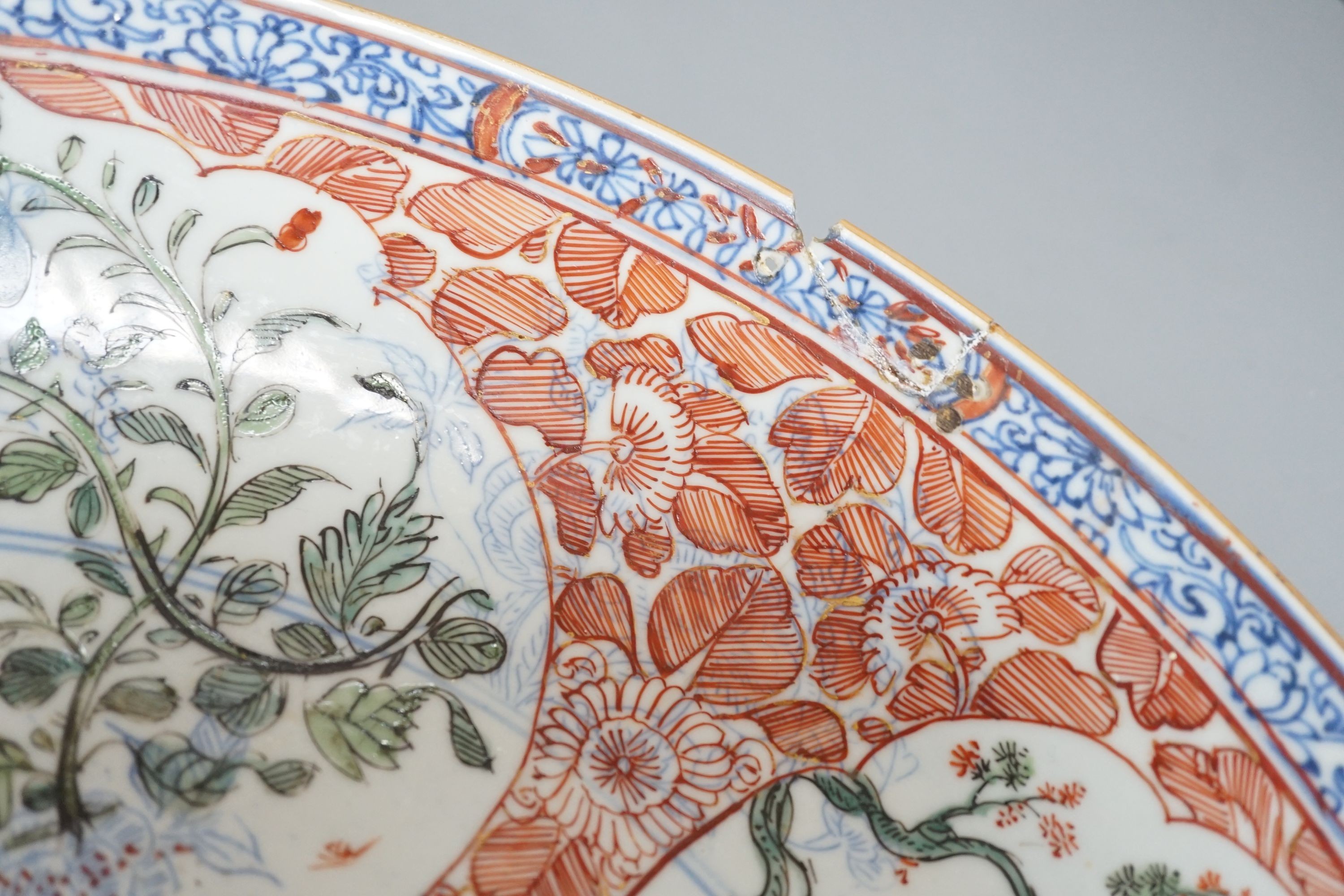 A large Chinese Kangxi dish, clobbered decoration, 37 cms diameter.